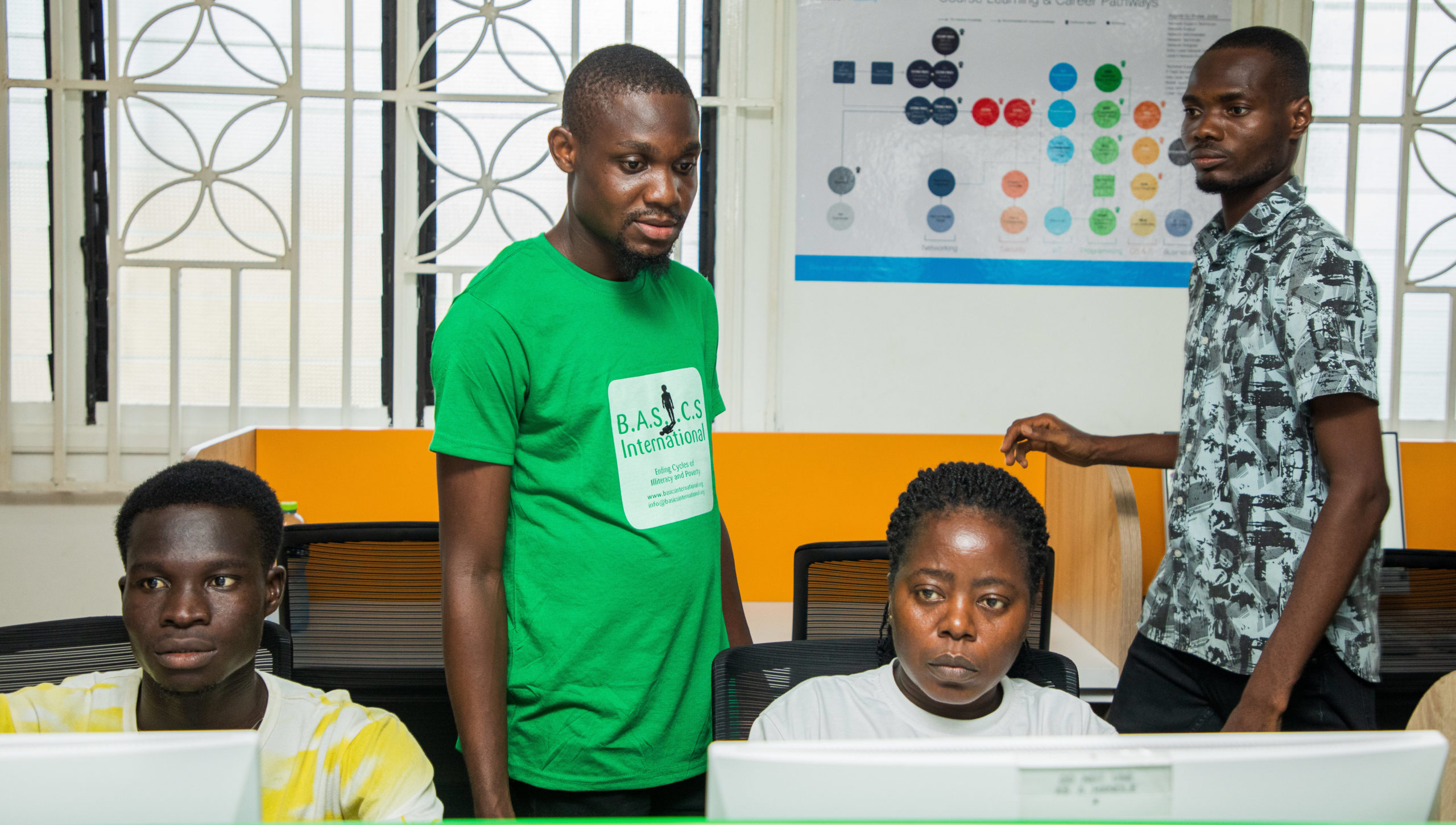 Chorkor Digital Lab students working on desktop computers.